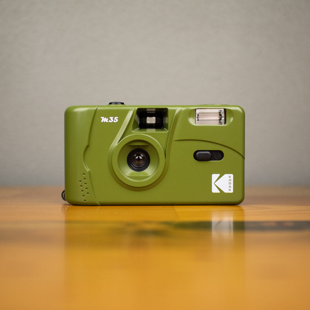 A front view of a green-colored Kodak M35 Film Camera.