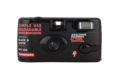A front view of the Lomography Simple Use reusable camera loaded with black & white film.